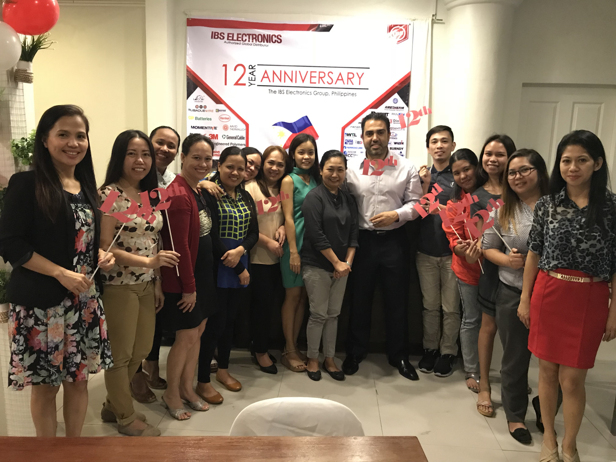 Group photo with the IBS Team at the 12th year celebration event.